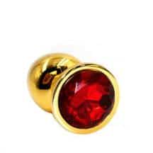 Анальная пробка Kanikule Small, золотистая с красным кристаллом. Нет в наличии Анальная пробка Kanikule Small, золотистая с красным кристаллом