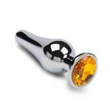 Анальная пробка маленькая Пикантные Штучки с оранжевым кристаллом, серебристая, 8.5 см