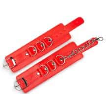 Наручники с кольцами и заклепками Пикантные штучки, красные