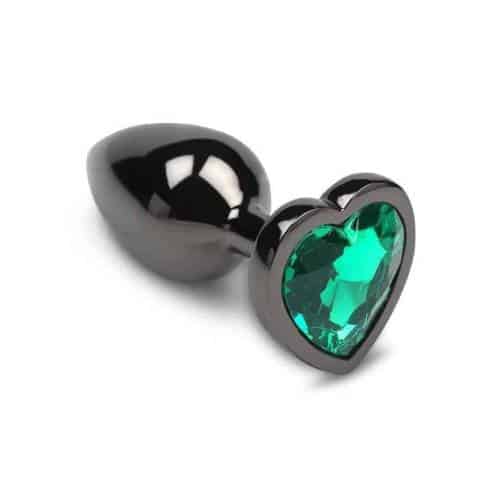 Большая анальная пробка Пикантные Штучки с зеленым кристаллом в виде сердечка, серебристая, 8.5 см