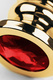 Анальная пробка Metal by Toyfa ребристая с красным кристаллом, золотистая
