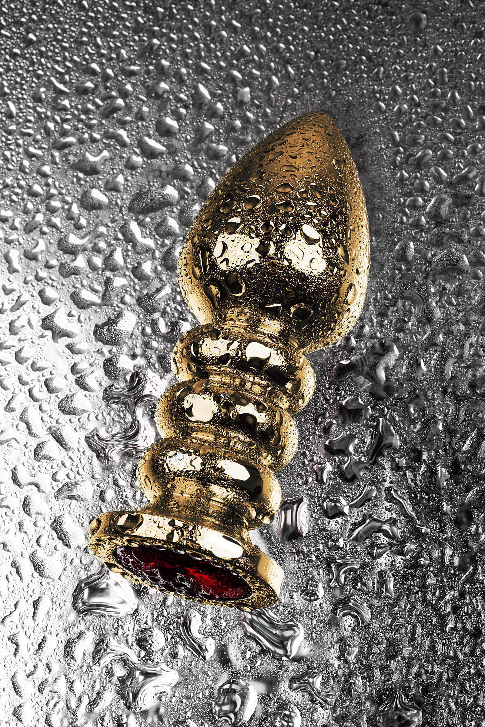 Анальная пробка Metal by Toyfa ребристая с красным кристаллом, золотистая